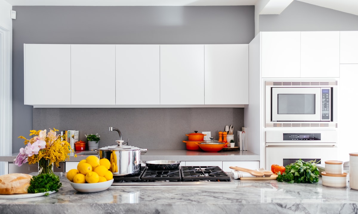 A pristine white kitchen after a professional clean